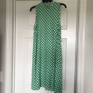 Green and white, sleeveless, shift dress.